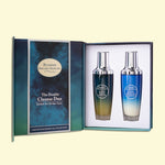 Blumain Organic Skincare Double Cleanse Duo gift set, featuring two skincare bottles with silver caps inside an open dark blue and teal gift box on a pale yellow background.