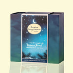 A boxed skincare product from Blumain Organic Skincare called 'The Overnight Renewal Ritual,' shown in a square box with a winter-themed label. The box has a dark blue and teal gradient design with a central label featuring a crescent moon, stars, and pine branches, set against a pale cream background.