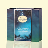 A boxed skincare product from Blumain Organic Skincare called 'The Overnight Renewal Ritual,' shown in a square box with a winter-themed label. The box has a dark blue and teal gradient design with a central label featuring a crescent moon, stars, and pine branches, set against a pale cream background.